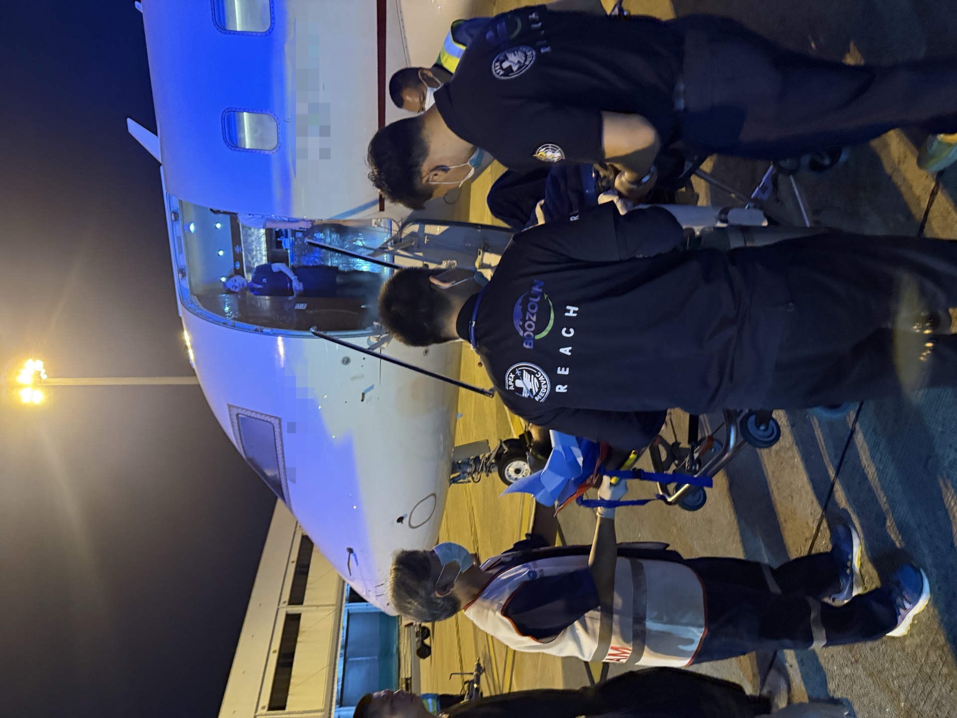 Air ambulance coordinated transfer - escorting a patient onto the aircraft